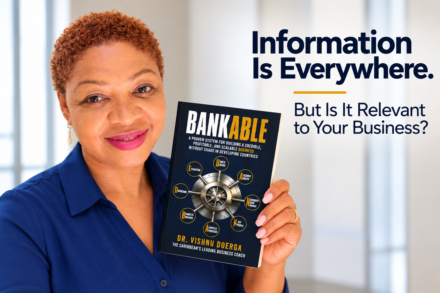 Sharon Brusch holding the book Bankable in a bright office setting